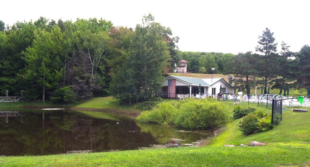 Club house with pond in the foreground